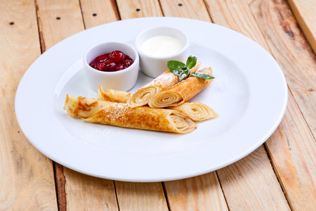 pancakes with jam and sweet sauceの写真素材