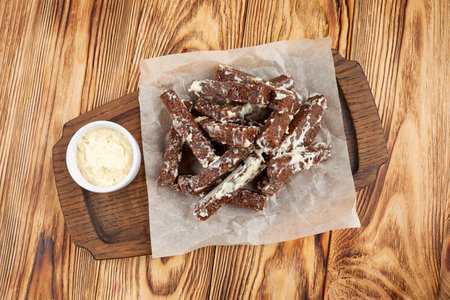 Crunchy bread snacks on wooden backgroundの写真素材
