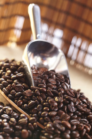 coffee beans on the spoonの写真素材