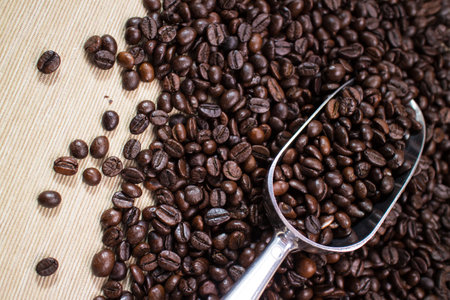 coffee beans on the spoonの写真素材