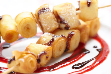 fried sweet rolls with sauceの写真素材