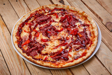 tasty pizza on the wooden backgroundの写真素材