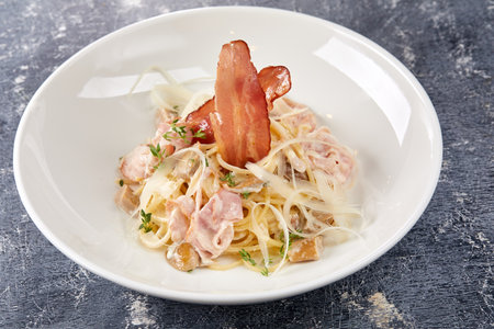 Carbonara pasta. Spaghetti with pancetta, egg, parmesan cheese and cream sauceの写真素材