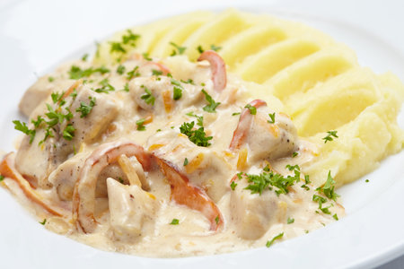 mashed potatoes with meat and sauceの写真素材