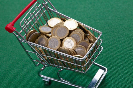 coins in the shopping basketの写真素材