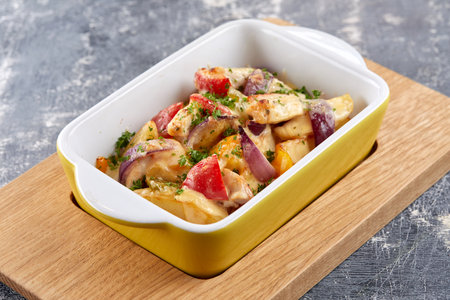 chicken with baked potatoes and vegetablesの写真素材