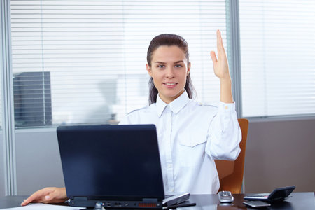 Young businesswoman sitting at workplaceの写真素材