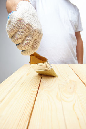men with brush in glovesの写真素材