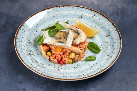 white fish with rice and vegetablesの写真素材