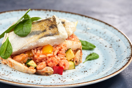 white fish with rice and vegetablesの写真素材
