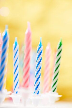 birthday candles on the yellow backgroundの写真素材
