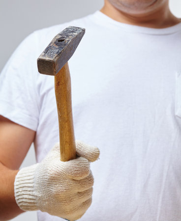 man in gloves with hammerの写真素材