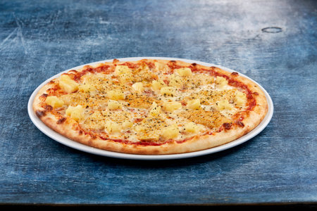Italian pizza on the white plateの写真素材