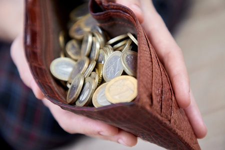 man hand putting money closeupの写真素材