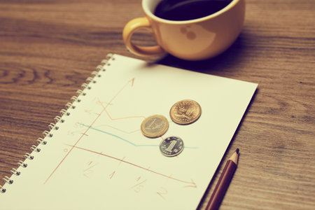 business concept - coins on the noteの写真素材