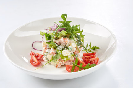 Russian salad on the white plateの写真素材