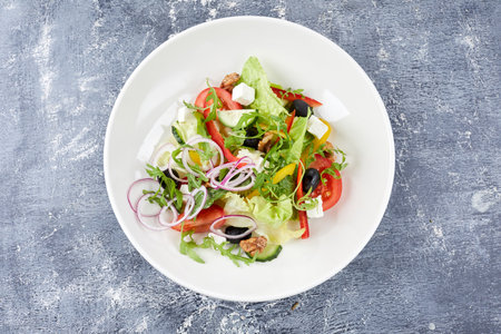 Greek salad on the gray backgroundの写真素材