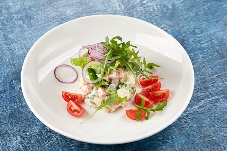 Russian salad on the white plateの写真素材