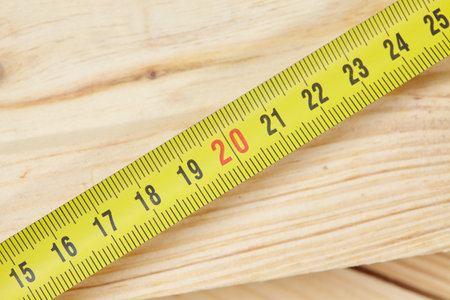 Yellow tape measure on the tableの写真素材