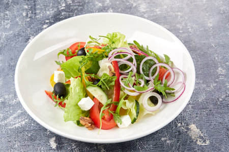 Greek salad on the gray backgroundの写真素材