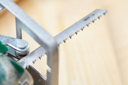 electric fretsaw on a wooden tableの写真素材