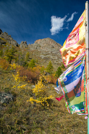 Buddhist flags fluttering in the wind in Mongoliaの写真素材