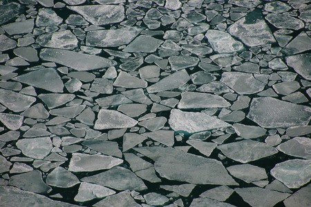 Breakaway ice floes floating in open water in Baikal lakeの写真素材
