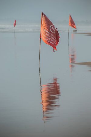 A red flag prohibits swimming in sea