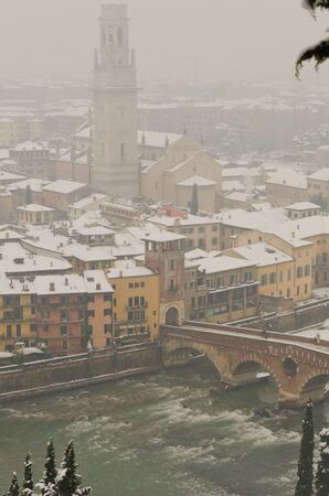 Verona, located in the fog and under a heavy snowfallの写真素材