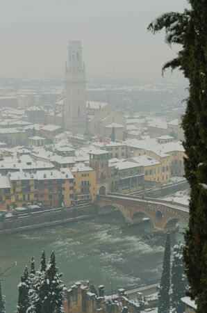 Verona, located in the fog and under a heavy snowfallの写真素材