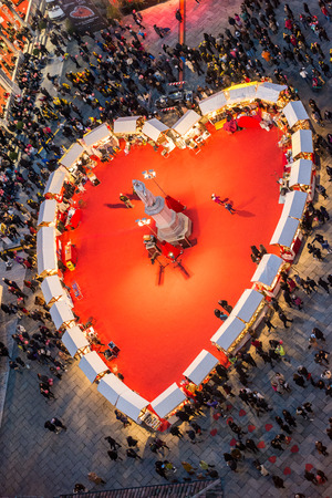 Verona, Italy - February 14, 2014: People walk in the Piazza Dante (Courtyard of the old market), where a large red heart has been placedのeditorial素材