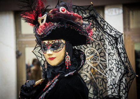 Venice, Italy - February 13, 2015: A wonderful mask participant of the annual carnival celebrations.の写真素材