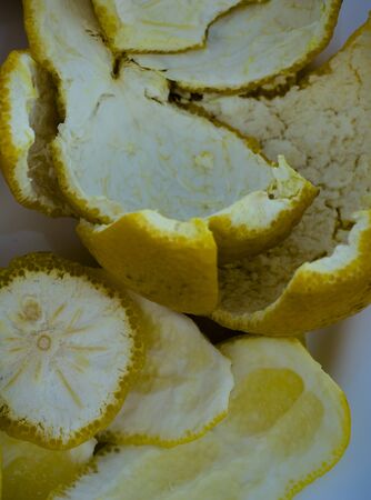 A closeup of fresh lemon peels inside out in a macro shootの写真素材