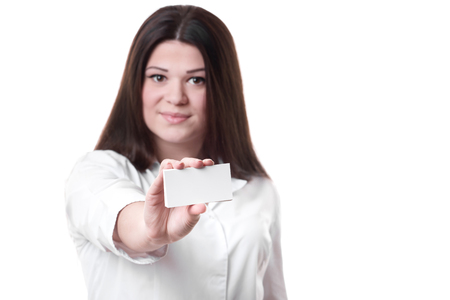 female doctor holding an empty card, isolated on white backgroundの写真素材