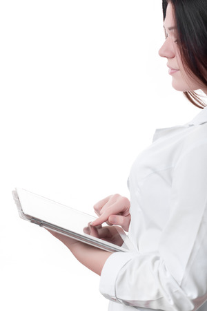 Happy female doctor using tablet computer isolated on backgroundの写真素材