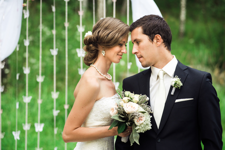 Portrait of newlyweds looking at each other gentlyの写真素材