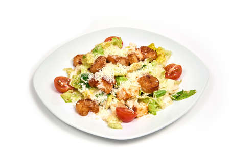Fresh salad with shrimp and parmesan cheese on round plate isolated on white backgroundの写真素材