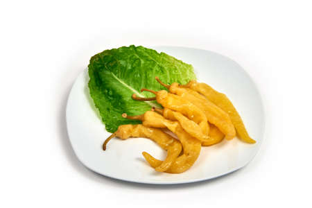 Braised pepper on a plate on white background. Serving dishes in a cafe, restaurant, for a menu.の写真素材