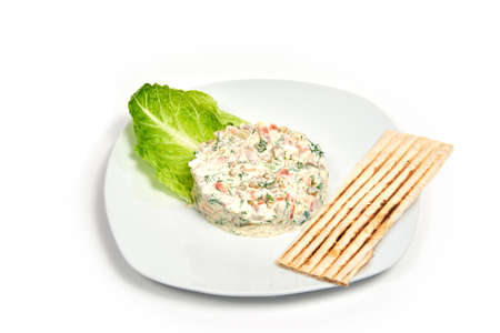 Russian salad "Olivier". Isolated on white background. Serving dishes in a cafe, restaurant, for a menuの写真素材