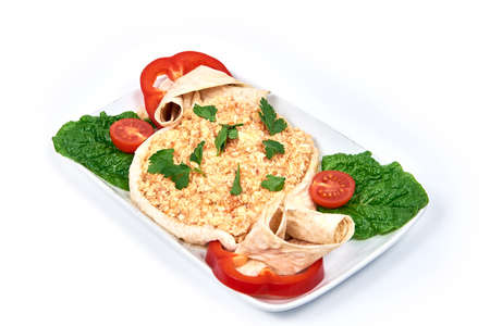 Fried eggs in pita bread on a plate on white background. Serving dishes in a cafe, restaurant, for a menu.の写真素材