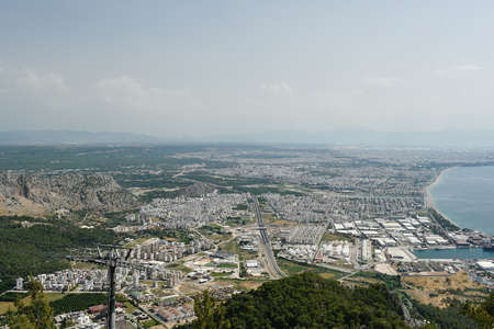 Panoramic aerial view of Antalya city from Tunektepe mountain, Turkey. An aerial view of the bay Alanya in Antalya Turkey. Sea and city with an open sky. Horizontal color photography.の写真素材