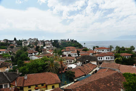 Panoramic views of the roofs old town Antalya. Old town Kaleici. Nice red tile roofs of the Antalya Old Town with see Turkeyの写真素材