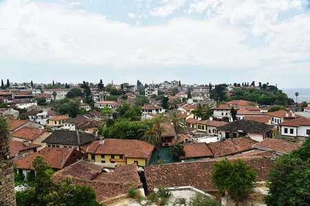 Panoramic views of the roofs old town Antalya, Turkey. Old town Kaleici. The oldest town in Antalya, looking horizontally with old houses and house roofsの写真素材