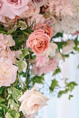 Lush floral arrangement of white and pink fresh flowers. Vertical photographyの写真素材