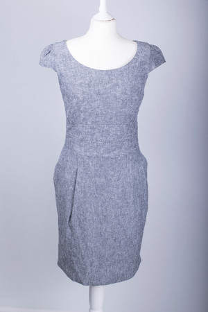 A Tailors Mannequin dressed in a Grey Fitted Work Dressの写真素材