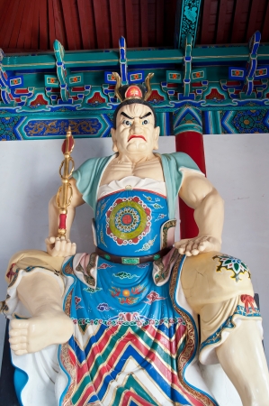 Buddhist guardian at the entrance to Daxiangguo Temple, Kaifeng, Chinaの写真素材
