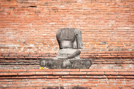 Damaged Buddha statue in the grounds of Wat Mahathat, Ayutthaya, Thailandの写真素材