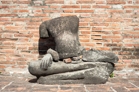 AYUTTHAYA, THAILAND - JUNE 10 2015 - Headless Buddha statue at Wat Mahathat on June 10, 2015 in Ayutthaya, Thailand. Wat Mahathat is one of Ayutthaya's most famous temples and is part of the Ayutthaya World Heritage Historical Park.のeditorial素材