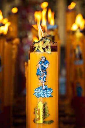 Burning candle at a Chinese templeの写真素材