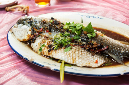 Steamed fish in black bean and soy sauce at Hong Kong restaurantの写真素材